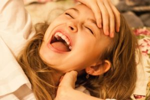 Laughing is healthy - unless you can't stop mass hysteria