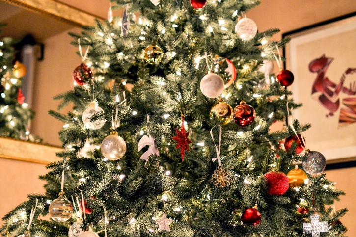 Decorating Christmas trees originated in 16th century Germany with hanging apples on trees to represent the biblical tree of forbidden fruit. 