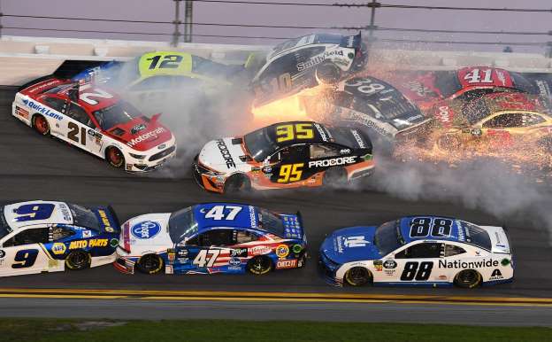Major pileup with just ten laps to go at the Daytona 500, later won by Denny Hamlin.