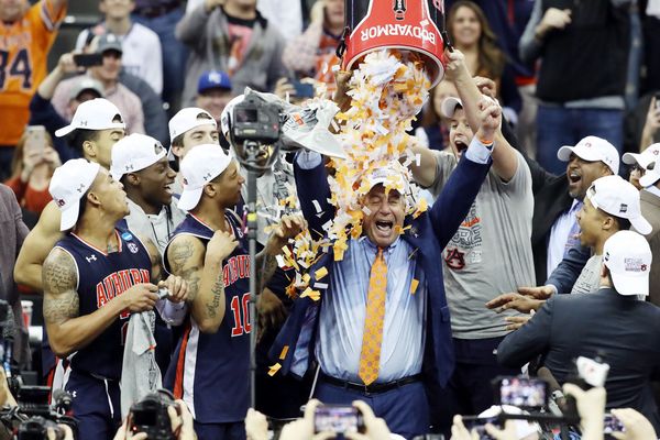 Auburn Head Coach Bruce Pearl gets a confetti shower for leading his team to the NCAA Final Four.